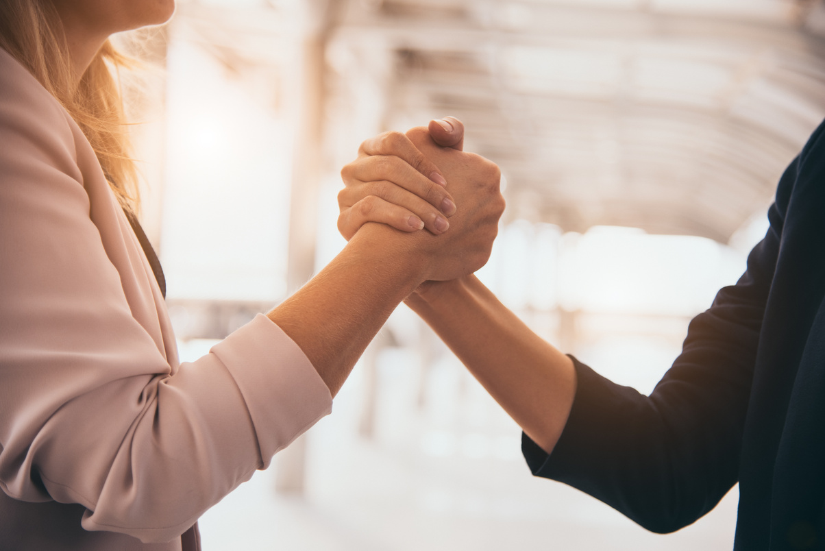 Female Business Partners Handshaking